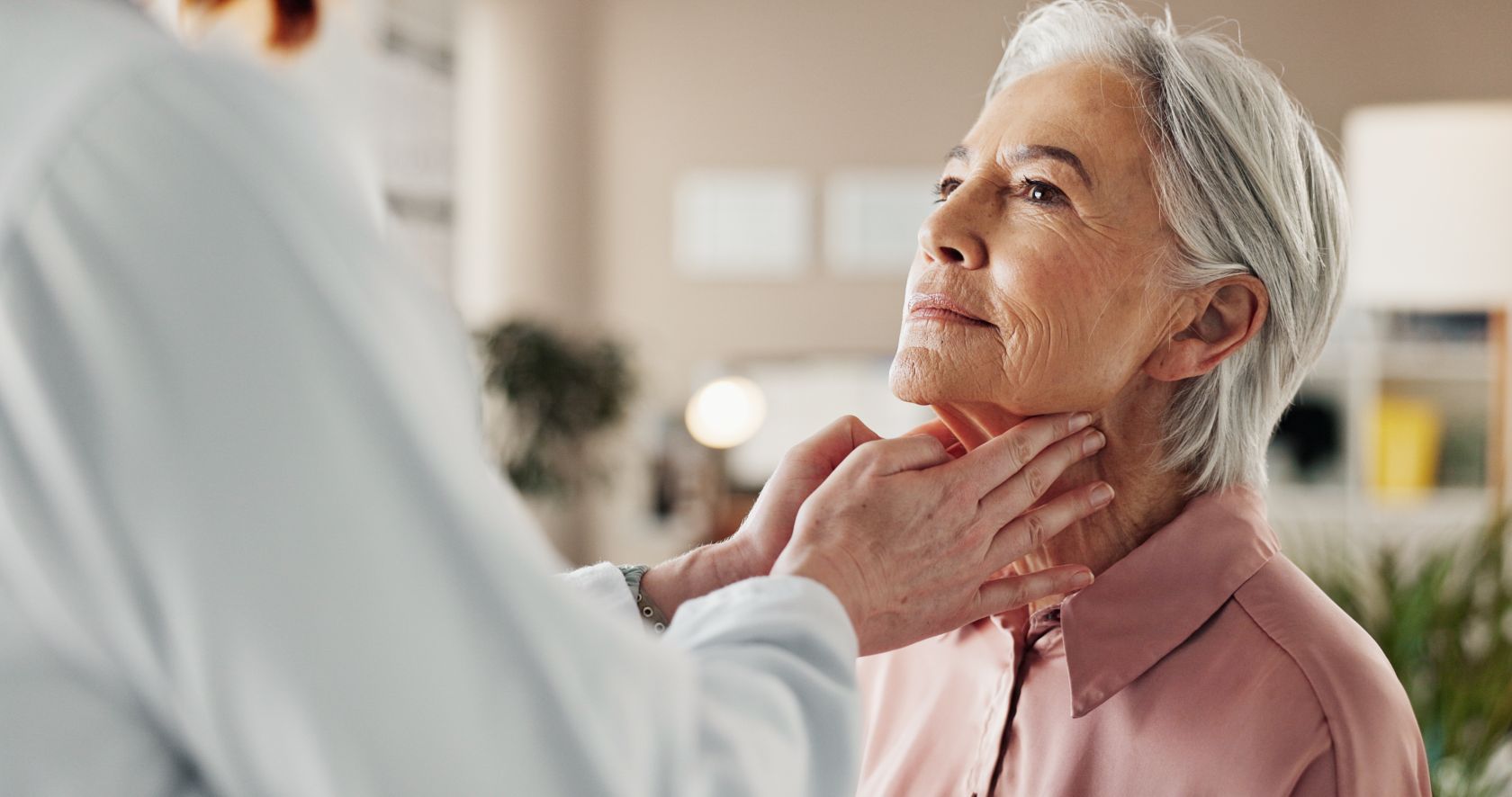 Georgia ENT Specialists homepage banner of woman getting her throat examined